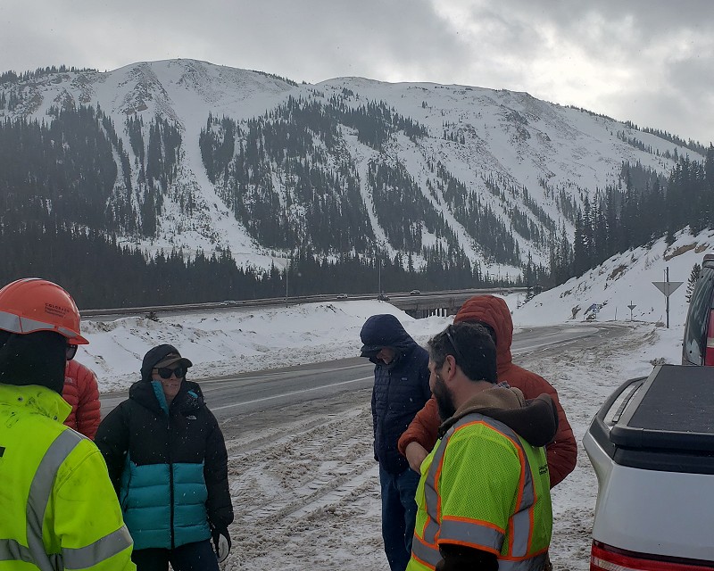 Ethan and Brian showing the Gazex chambers over the Seven Sister avalanche paths