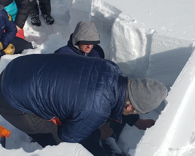 Kelly Elder showing the year 2 students and Ben Pritchett how to use a dial gauge to measure displacement and rebound when loading and unloading of an above skier.